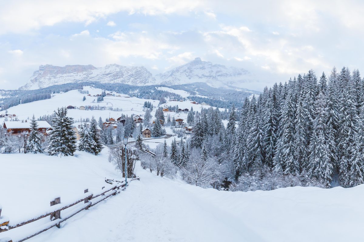 The beautiful mountains covered in snow under the cloudy sky - great for wallpapers